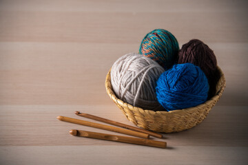 Yarn balls and crochet needles.
  - obrazy, fototapety, plakaty
