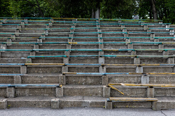 empty spectator seats in the stadium. The lack of benches