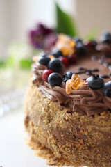 Beautiful brown chocolate cake with fresh berries. Blueberry. Happy birthday