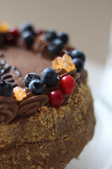 Beautiful brown chocolate cake with fresh berries. Blueberry. Happy birthday