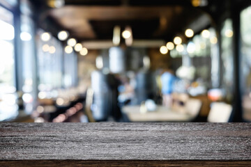 Fototapeta na wymiar Desk space platform over blurred restaurant or coffee shop background for product display montage.