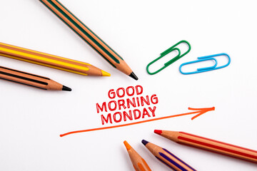 GOOD MORNING MONDAY. Red directional arrow and colored pencils