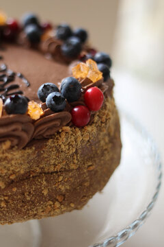 Beautiful brown chocolate cake with fresh berries. Blueberry. Happy birthday