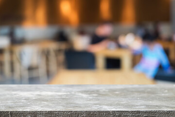 Empty wooden table space platform and blurred restaurant or coffee shop background for product display montage.