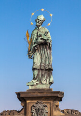 Fototapeta na wymiar Statue of John of Nepomuk on the Charles bridge in Prague
