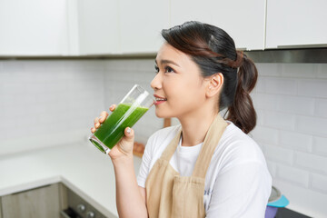 Healthy Lifestyle Concept. Close up portrait of smiling girl drinking morning smoothie made of super foods