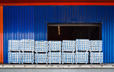 Pack of aluminum ingot bar stack on warehouse dock for container stuffing. Distribution warehouse...