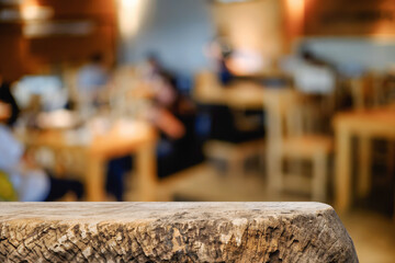 Empty wooden table space platform and blurred resturant or coffee shop background for product display montage.