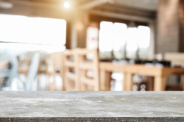 Empty wooden desk space platform with blur restaurant or coffee shop background for product display montage.