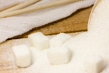 Wooden spoons and sugar. Diet. A lot of sugar.