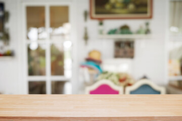 Empty wooden table space platform and blurred resturant or coffee shop background for product display montage.
