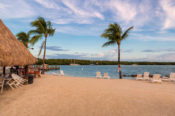 Beach resort and palm trees at sunset on a tropical island Key Largo, Florida, USA
