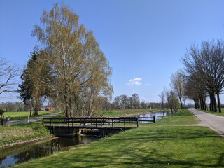 Fototapeta na wymiar Bridge over a canal around Marienvelde