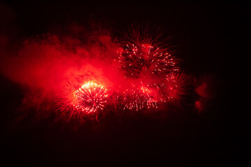 Close-up photo of a firework in the sky at night. Fireworks for the holiday. Background.