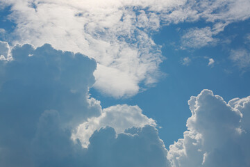 Naklejka na ściany i meble fluffy cloud above clear blue sky