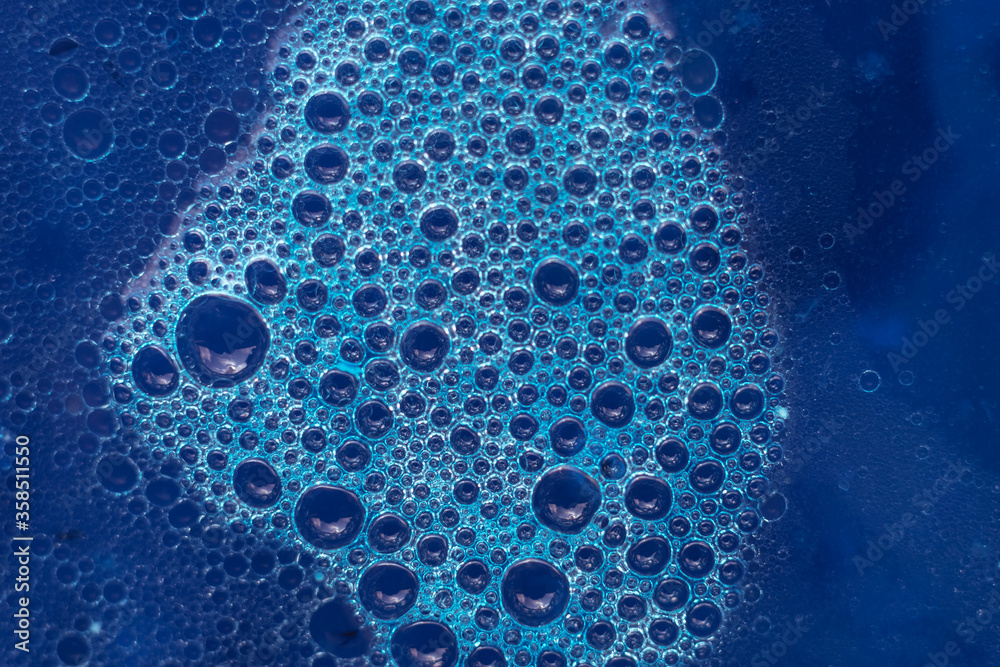 Aufkleber Beautiful abstract blue bubbles background pattern texture for design . Macro view.