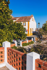 Cute corner in the picturesque village of Constancia, Portugal, with its typical white and yellow houses. Slow travel photo concept