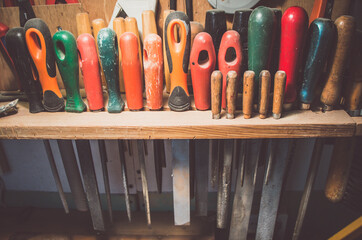 A row of hand files in a workshop. Old and new.