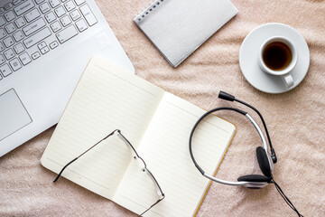 Home office concept. Laptop, notebook on blanket top view