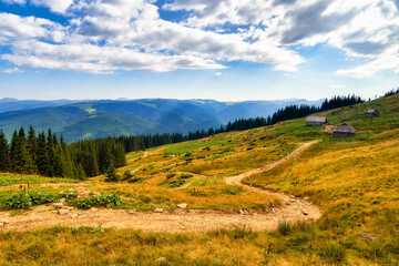 Mountain path hiking or trekking Carpathian landscape, summer nature outdoor road view. Adventure tourism scenic way trail. Blue sky and clouds, sunny beautiful day.