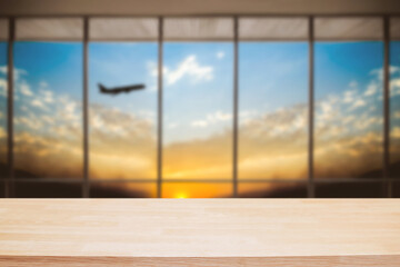 Fototapeta na wymiar Empty wooden table space platform and Airport background for product display montage.