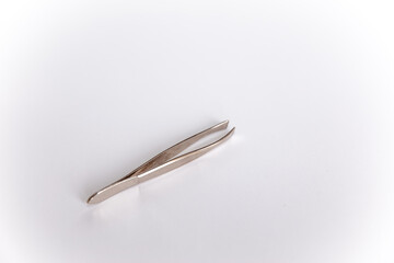 Cosmetic forceps isolated on white background. Cosmetic tweezers.