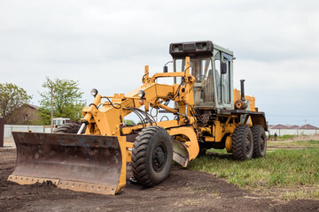 Yellow bulldozer with bucket. Wheel Loader. Heavy Equipment Machine. Tractor Front Loader. Construction Machinery.