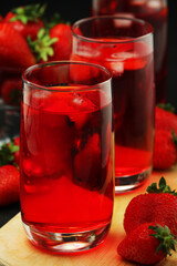 Glasses with strawberry drink with ice