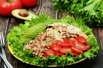 Turkey breast, avocado, salad and buckwheat as healthy lunch
