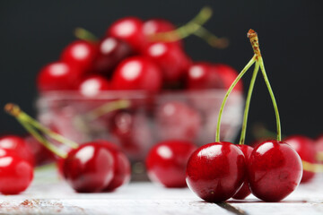 A small glass bowl with ripe fresh cherry