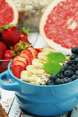 Healthy diet breakfast including cereal with berry and fruits