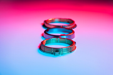 The individual elements of the transmission gear in the gearbox. A new set of synchronizers in brass in blue and red.