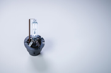 New xenon lamp on a gray gradient background. The concept of discharge lamps to replace...
