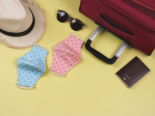COVID-19 prevention while traveling and new normal lifestyle concept. Top view of  polka dot fabric...