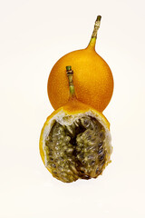 one juicy vibrant orange grenadilla isolated on a white background close-up
