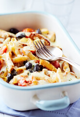 Pappardelle Pasta with Vegetables and fresh Basil on bright wooden Background. Close up.
