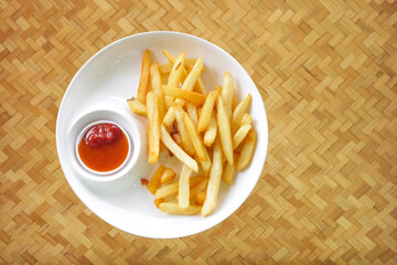 potato fry,french fries with ketchup on wooden table background,home cooking tasty.