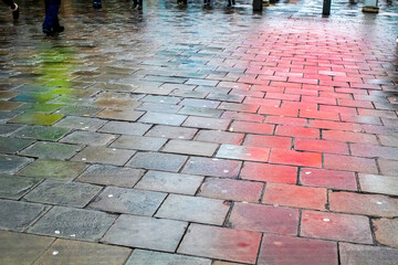 Wet pavement colourful reflections Northumberland Street Newcastle