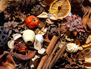 A close-up background mixture of dried woodland potpourri items. 