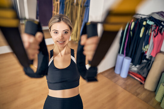 Female Athlete Performing A TRX Row Exercise