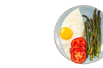 Healthy homemade breakfast with asparagus, fried egg and arugula. quarantine healthy eating concept. keto diet.