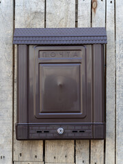 brown mailbox on the door
