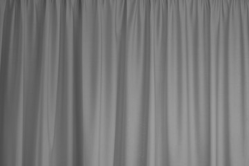 Grey curtain interior textile element close up background