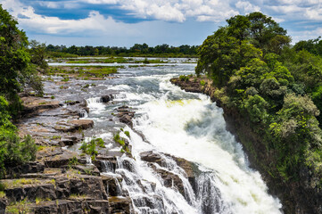 Fototapeta na wymiar It's Victoria Falls, boarder of Zambia and Zimbabwe. UNESCO World Heritage