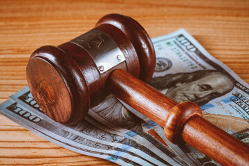 wooden gavel and money