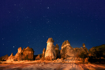 Fairy chimneys at night with stars in the sky, Cappadocia, Turkey