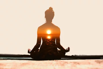 Muurstickers Yoga dag concept. Afbeelding met meerdere belichtingen. Vrouw beoefenen van yoga bij zonsondergang. © primipil