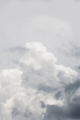 Dramatic gray clouds in the pale gray sky. Beautiful gray and white cloudy sky
