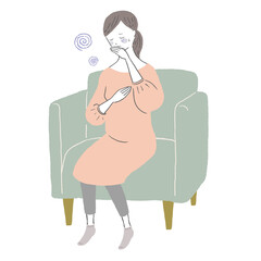 悪阻でソファーで休む妊婦