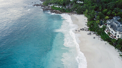 Seychelles beach Indian ocean from drone, shore and mountains. 